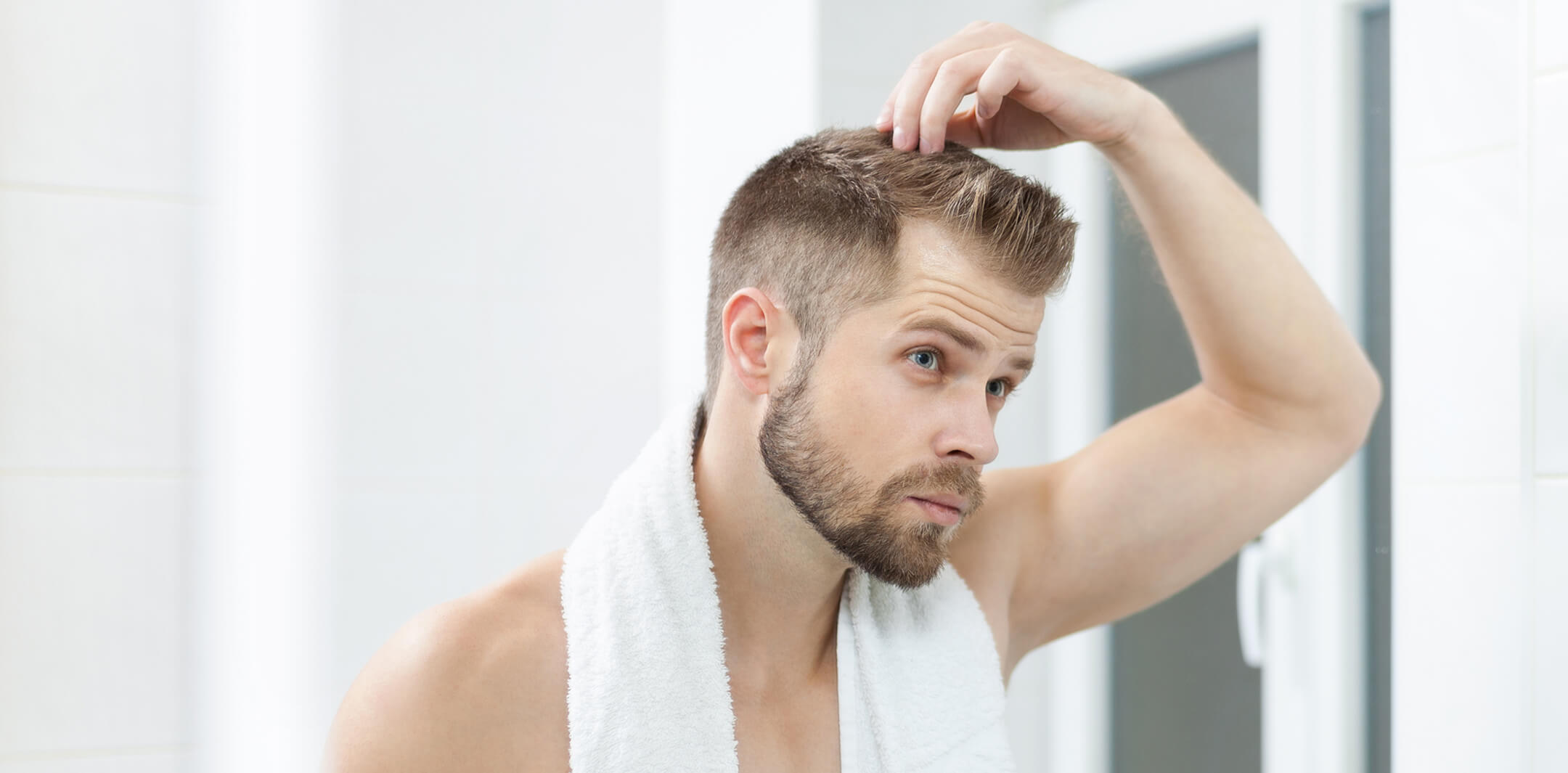 handsome-young-man-worried-about-hairloss-2024-09-19-12-00-38-utc (1)