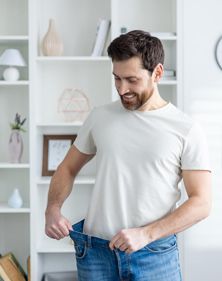 man-proudly-showing-weight-loss-in-casual-home-set-2025-03-24-22-23-51-utc 1 (1)