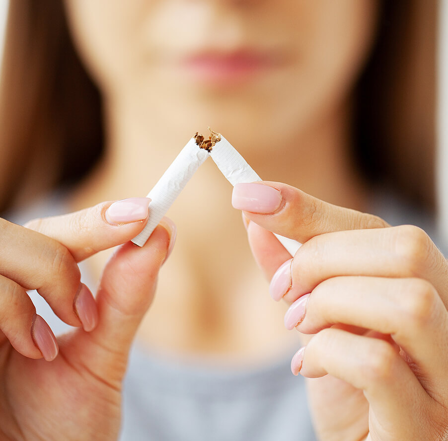 stop-smoking-woman-holding-a-broken-cigarette-2025-02-12-05-50-52-utc 1 (1)